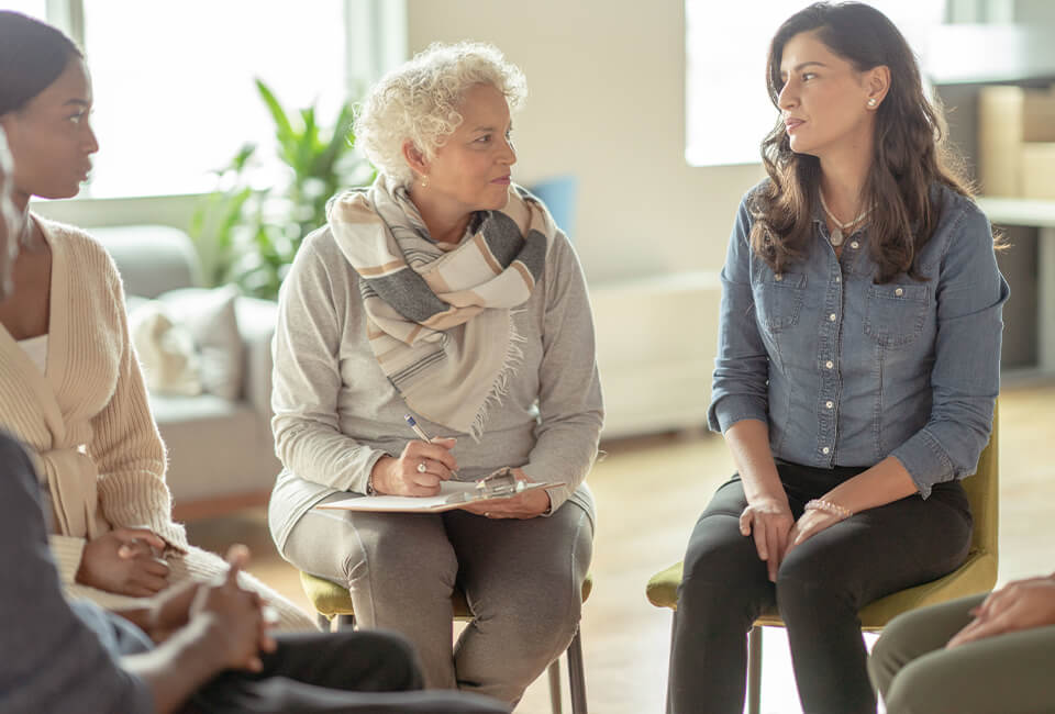 female psychiatrist talking to patients